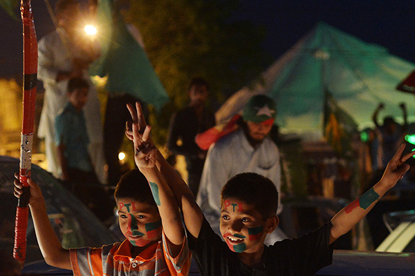 Supporters of the PTI after the polls closed on May 11. Farooq Naeem—AFP