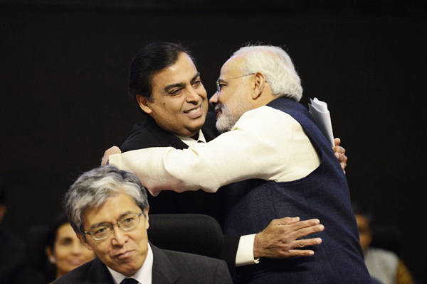 Ambani embraces Gujarat’s Modi, Jan. 11. Sam Panthaky—AFP