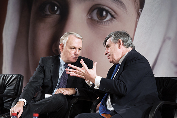Brown with the French prime minister at the ‘Stand Up for Malala’ event on Dec. 10 in Paris. Bertrand Langlois—AFP