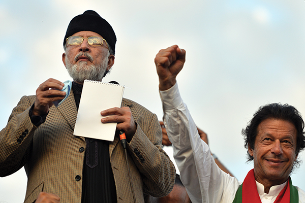 The two protest leaders united by a sound-system glitch. Aamir Qureshi—AFP