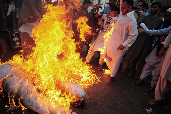 PMLN activists burn Modi in effigy, Sept. 30, Karachi. Asif Hassan—AFP